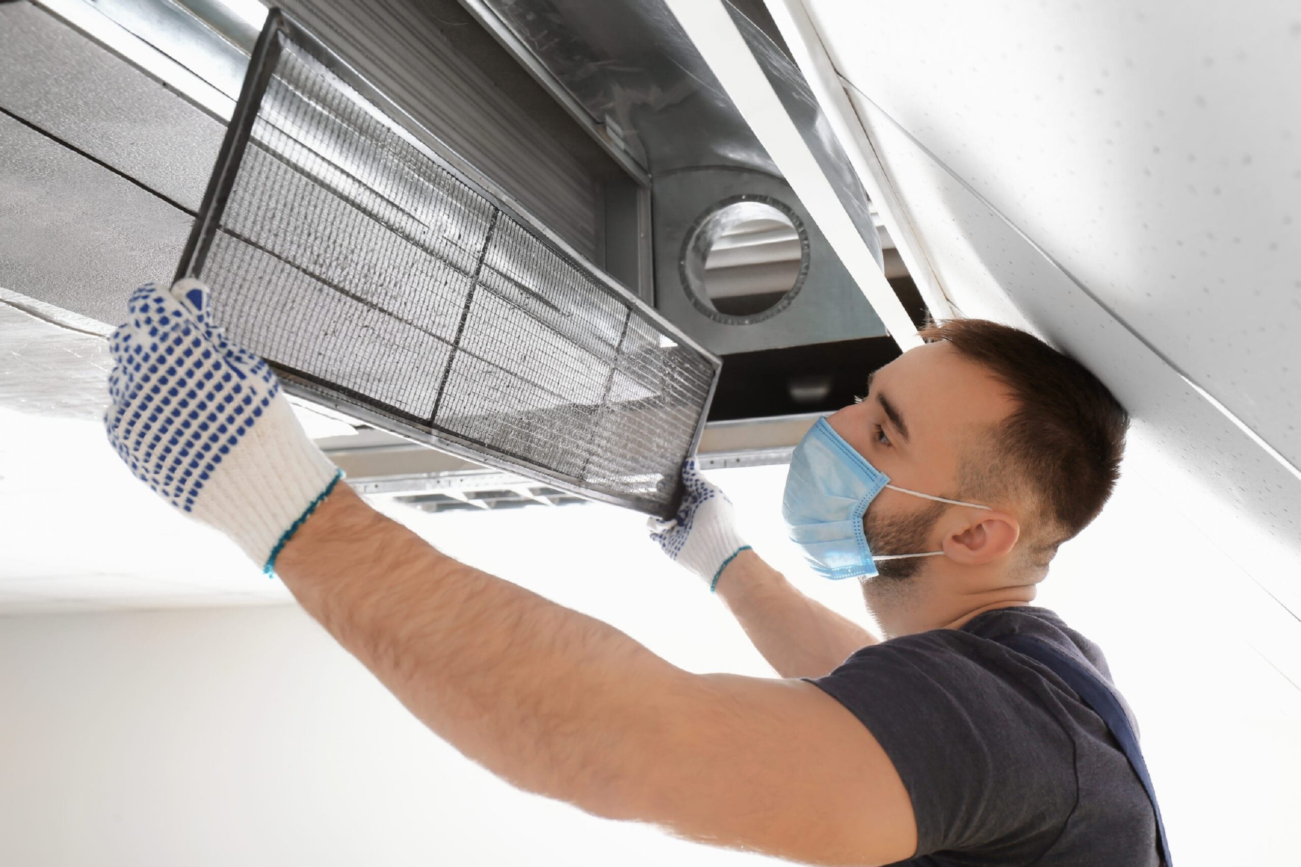 air duct filter installing guy